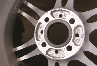 The offset will usually be embossed on the back of one of the spokes.